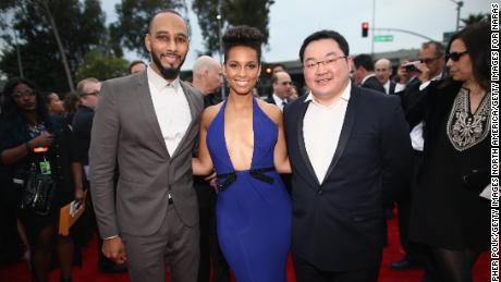 Jho Low attends the 2014 Grammy Awards alongside producer Swizz Beatz and musician Alicia Keys. Low was chairman of EMI Music Publishing Asia at the time.