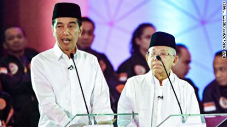 Presidential candidate and incumbent President Joko Widodo, pictured left, and his running mate, Maruf Amin, during a live nationwide TV debate in Jakarta on January 17.