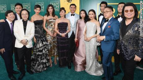 Kwan, right, poses for a picture with the cast and crew of "Crazy Rich Asians" at the film's August premiere at Los Angeles' Chinese Theatre.