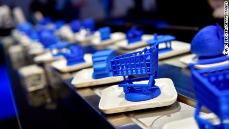 A conveyer belt with objects is used to demonstrate blockchain technology at the IBM booth at CES 2019.