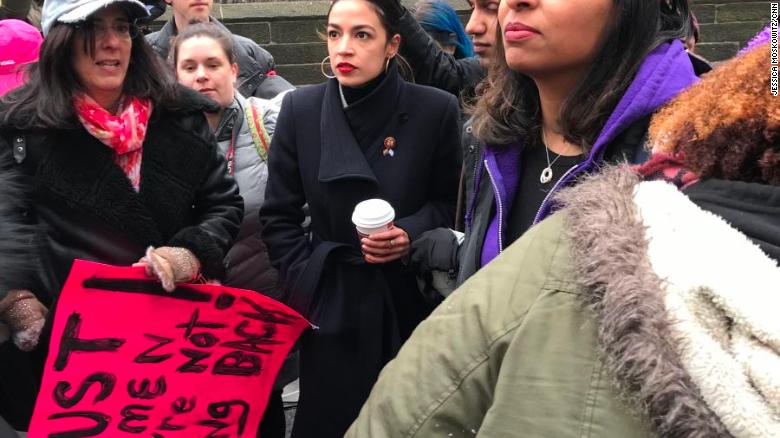 US Rep. Alexandria Ocasio-Cortez, center, attends a march event near Central Park in New York.