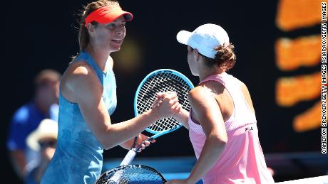 Maria Sharapova shakes hands with Ash Barty at the Australian Open. 