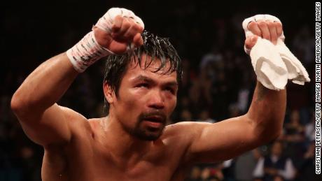 Manny Pacquiao celebrates after defeating Adrien Broner by unanimous decision during the WBA welterweight championship at MGM Grand Garden Arena.