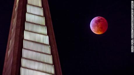 The super blood wolf moon rises behind the TransAmerica building in San Francisco.