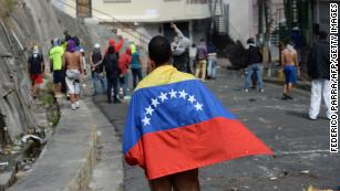 Maduro defiant as Venezuelan opposition leader declares himself acting president 