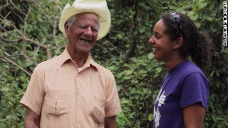 22-year-old volunteer Asia Baez talks with the homeowner she and her team are helping in Puerto Rico.