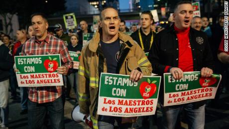 Firefighters marched Tuesday in support of Los Angeles teachers on strike. 