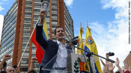 Venezuela's National Assembly head Juan Guaido speaks to the crowd during a mass opposition rally against leader Nicolas Maduro in which he declared himself the country's "acting president."