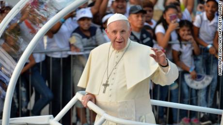 Pope Francis greets the faithful from the popemobile after arriving in Panama City for World Youth Day, on January 23, 2019. 