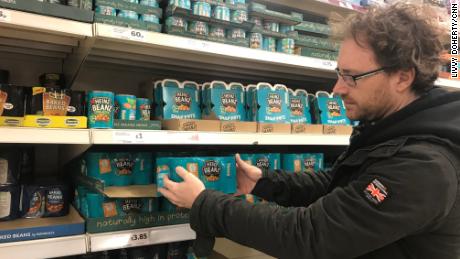 Graham Hughes stockpiles Heinz baked beans for his family at the supermarket.