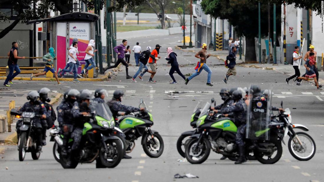 Police secure an area in Caracas on January 23.