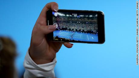 A fan takes in the Naomi Osaka-Karolina Pliskova match at the Australian Open. 