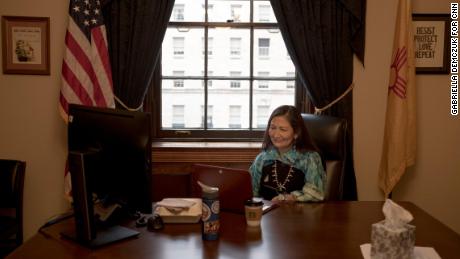 Haaland speaks to a reporter over a video conference call in her office.