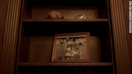 Pictures of family members sit on the shelf in Haaland's office.