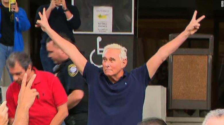 Roger Stone exits court with Nixonian salute