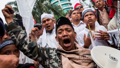 Members of various hardline Muslim groups celebrate after Jakarta's Governor was convicted of committing blasphemy on May 9, 2017 in Jakarta, Indonesia.