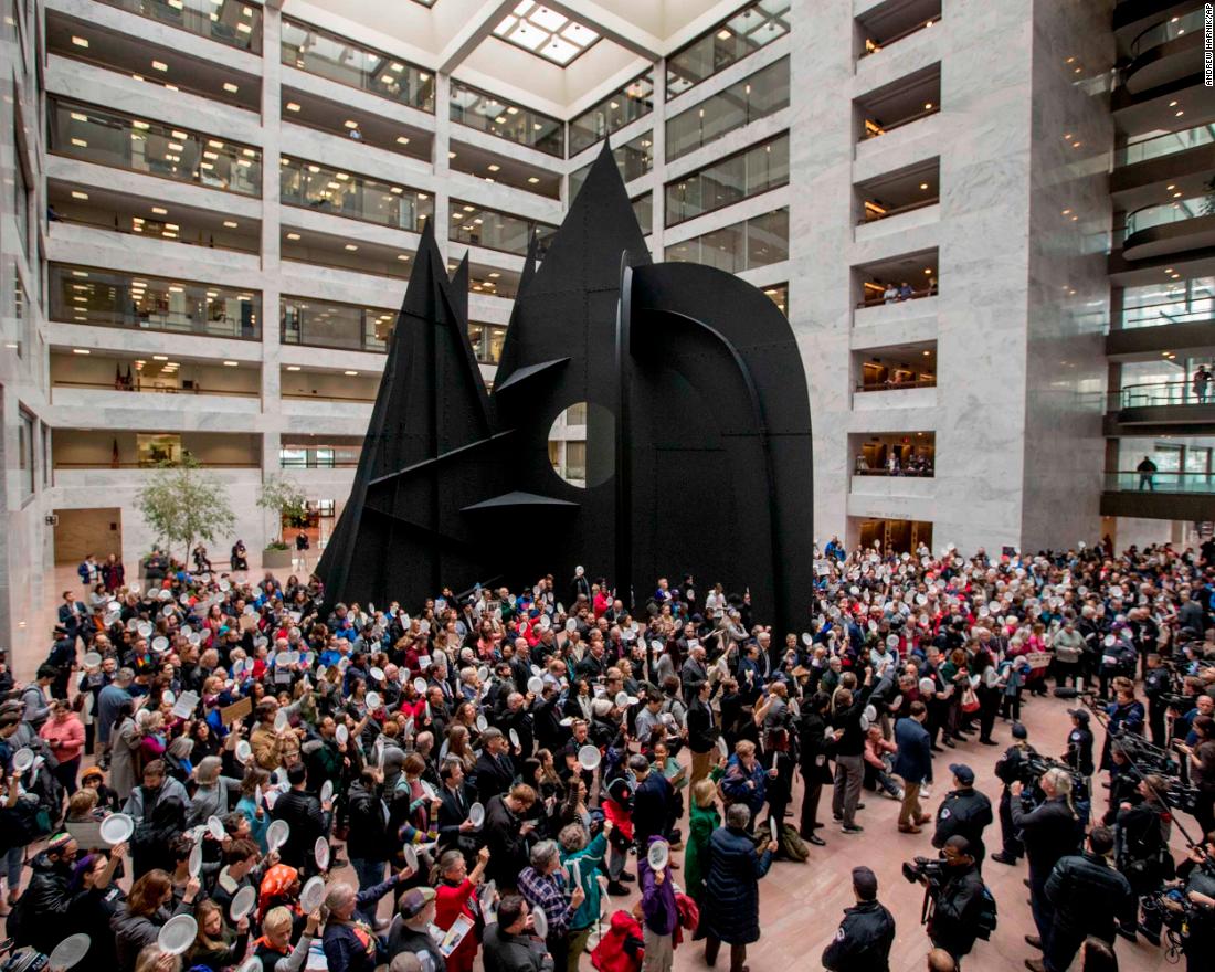 Furloughed government workers hold a silent protest on Capitol Hill on January 23.