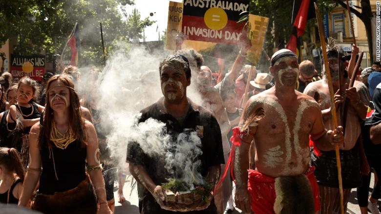 People take part in an &quot;Invasion Day&quot; rally on Australia Day in Melbourne on January 26, 2018.