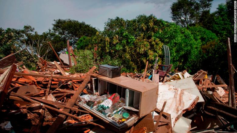 Debris is widespread Saturday in the Parque da Cachoeira community after the dam collapse.