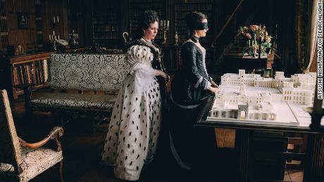 Queen Anne (Olivia Colman) surprises Sarah Churchill (Rachel Weisz) with a model of Blenheim Palace in "The Favourite."