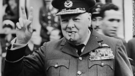 Winston Churchill gives his famous v-sign in 1948. 