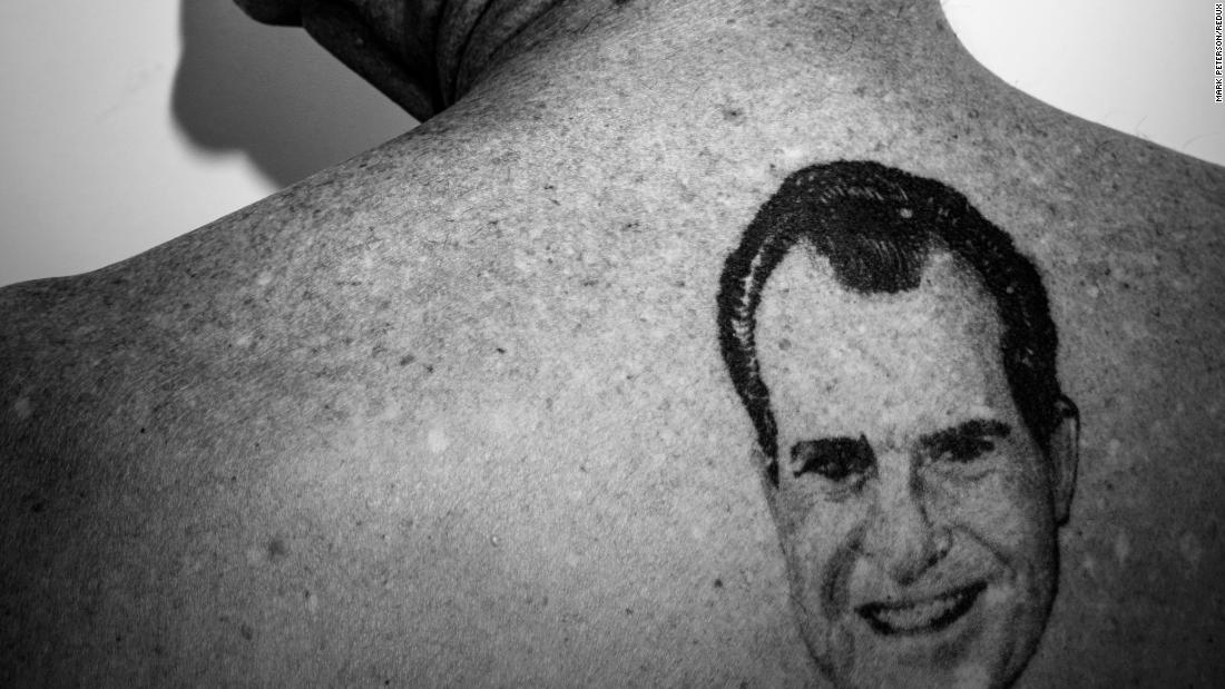 Stone shows a tattoo on his back of former President Nixon.