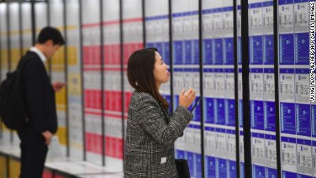 A woman looks at notices during a jobs fair in Seoul. Women often struggle to find a foothold in South Korea&#39;s male-dominated corporate culture and a series of firms have been caught using sexist recruitment targets to keep it that way.