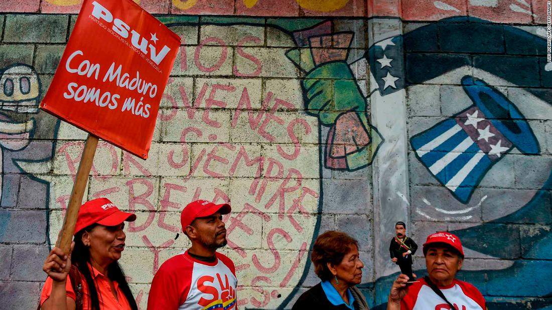 Government supporters in Caracas hold a rally in support of Maduro on January 26.