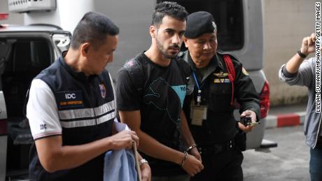 Hakeem Al-araibi is escorted by immigration police to a court in Bangkok on December 11, 2018.