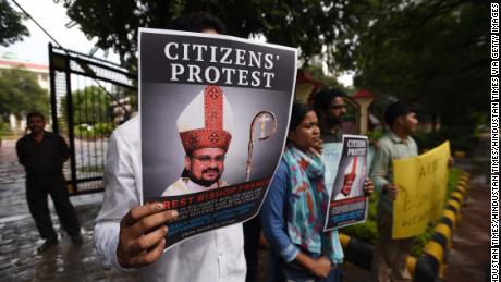 People hold a protest against Bishop Franco Mulakkal, after he was accused by a nun of raping her in the southern Indian state of Kerala. 