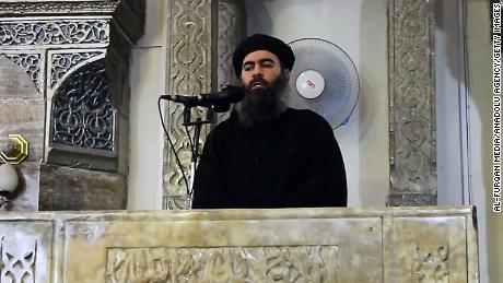 An image grab taken from a video released on July 5, 2014 by Al-Furqan Media shows alleged Islamic State of Iraq and the Levant (ISIL) leader Abu Bakr al-Baghdadi preaching during Friday prayer at a mosque in Mosul.