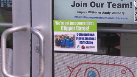 An anti-trafficking sticker is pictured on a door as part of Convenience Stores Against Trafficking, a program of the nonprofit In Our Backyard.