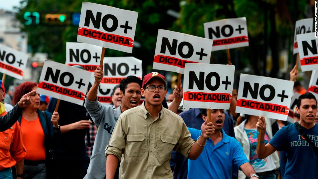 Opposition demonstrators protest against Maduro&#39;s government on Wednesday, January 30.