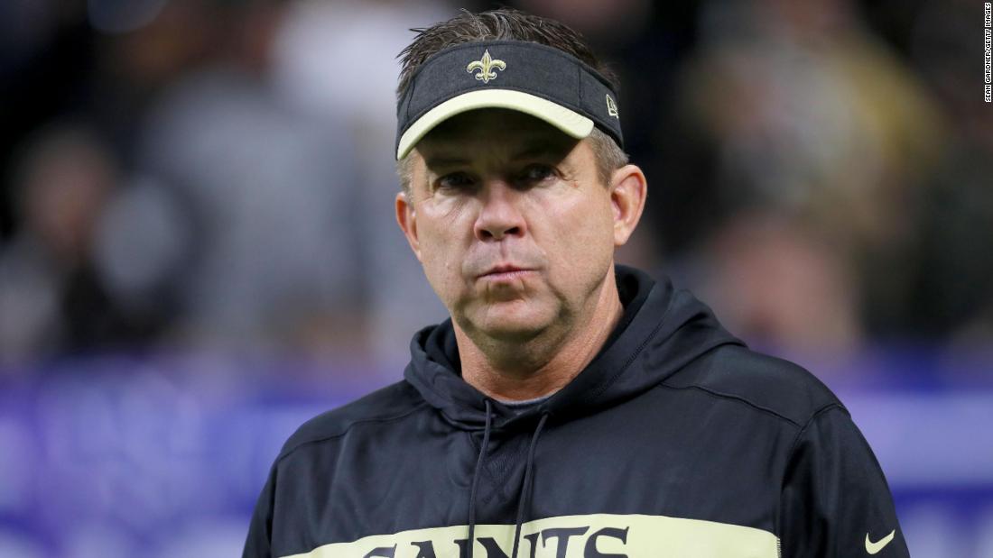 Former Saints head coach Sean Payton walks on the sideline before an NFL game 