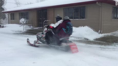 Pharmacist uses snowmobile to deliver medicine for snowed-in customers