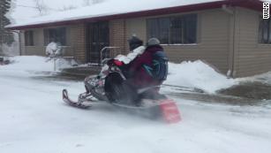 Pharmacist uses snowmobile to deliver medicine for snowed-in customers