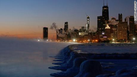 Ice lines the shore of Lake Michigan before sunrise on Thursday in Chicago.