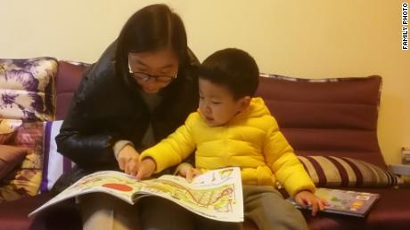 Chen Huijuan with her son Xiyan whose education and healthcare take up about a third of the household's salary.