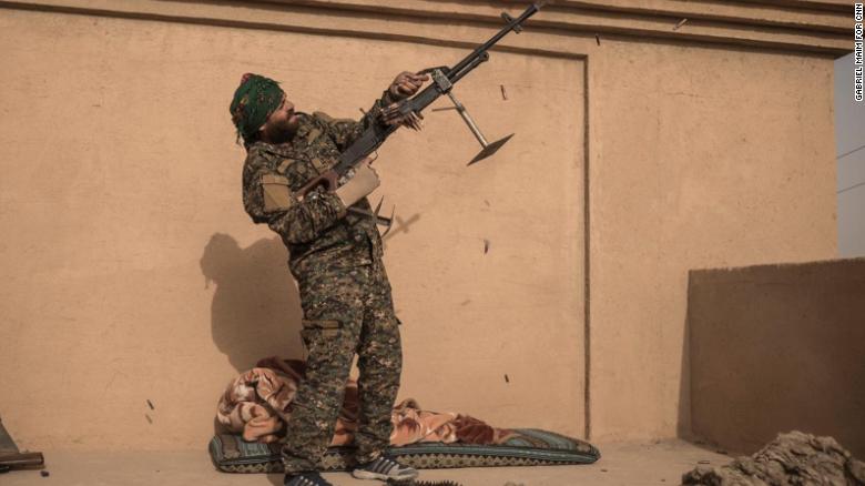 SDF Commander Haval Simco shoots at an ISIS drone in A-Shafa on January 10.