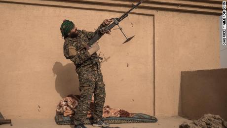 SDF Commander Haval Simco shoots at an ISIS drone in A-Shafa on January 10.