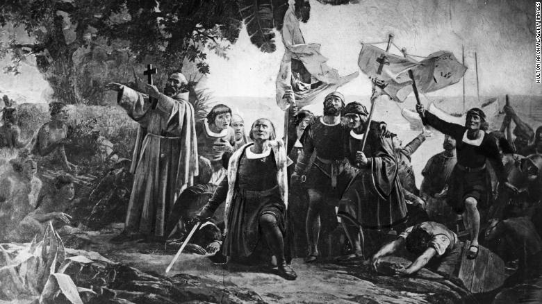 An artist&#39;s depiction shows Christopher Columbus landing in America in 1492 with the Piuzon brothers.