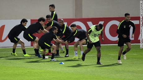 The Qatari team warms up during a training session ahead of the final.