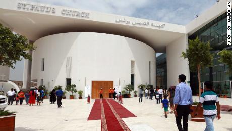 Catholic worshipers from different nationalities residing in the UAE, arrive for mass at the second church opened in the UAE, the St. Paul Church, a day after its inauguration in Abu Dhabi's industrial district of Musaffah on June 12, 2015.