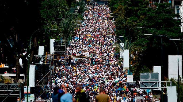 Activists pour into the streets of Caracas on Saturday, February 2, to back opposition leader Juan Guaido's call for early elections in Venezuela.