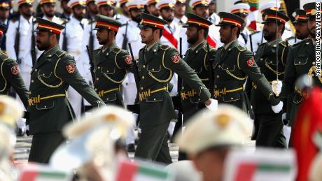 Guards march ahead of the arrival of Pope Francis at the presidential palace.