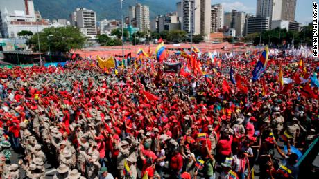 Thousands of public employees and government supporters gather in Caracas, Venezuela, Saturday, Feb. 2, 2019. 