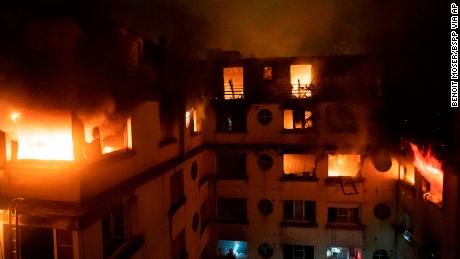 In this image provided on Tuesday, Feb. 5, 2012 by the Brigade de Sapeurs-Pompiers de Paris (Paris Fire Brigade) a fire rages through the top floors of an apartment building in Paris, France. The Paris fire service says seven people have been killed and at least 28 injured in a fire in a residential building. (Benoit Moser/BSPP via AP)