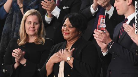 Alice Johnson (C), one of the US President's special guests, reacts as the president acknowledges her during his State of the Union address at the US Capitol in Washington, DC, on February 5, 2019. (Photo by SAUL LOEB / AFP)        (Photo credit should read SAUL LOEB/AFP/Getty Images)
