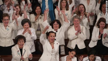 WASHINGTON, DC - FEBRUARY 05:  Female lawmakers cheer during President Donald Trump&#39;s State of the Union address in the chamber of the U.S. House of Representatives at the U.S. Capitol Building on February 5, 2019 in Washington, DC. A group of female Democratic lawmakers chose to wear white to the speech in solidarity with women and a nod to the suffragette movement.  (Photo by Alex Wong/Getty Images)