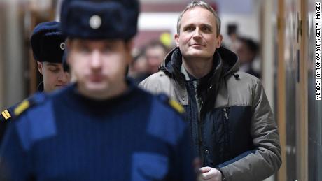 Dennis Christensen, a Jehovah&#39;s Witness, is escorted at a courthouse Wednesday in Oryol, Russia. 